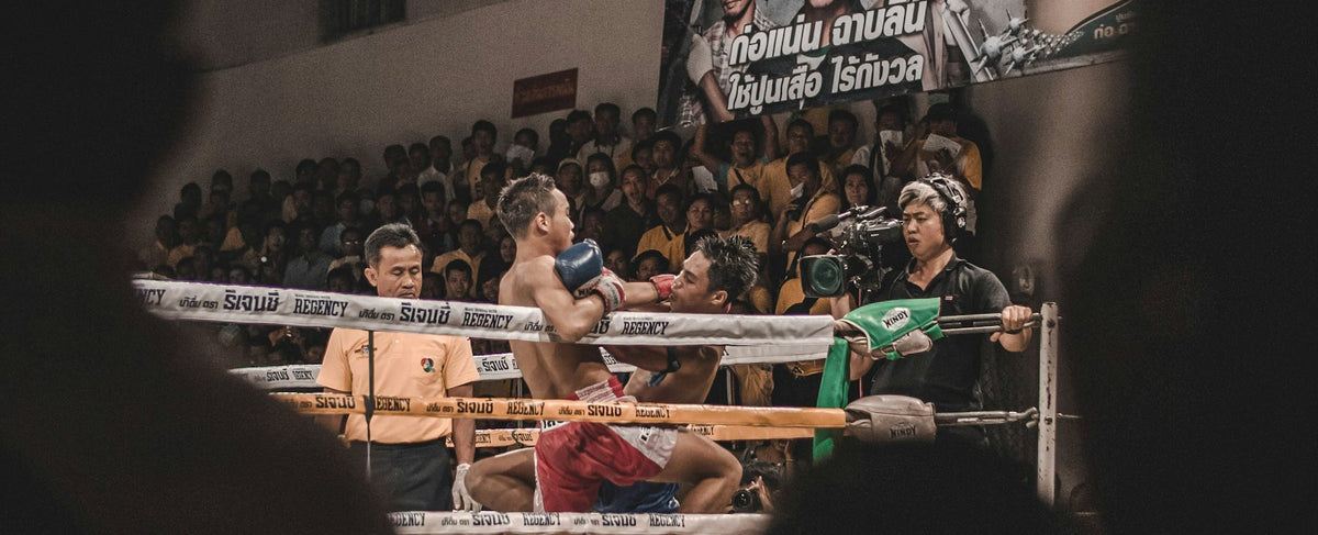Boxing ring under the spotlights in a dark arena — the discipline of Creed and the world of Michael B. Jordan, around Yves Saint Laurent's La Nuit de L'Homme, by Olara perfumery